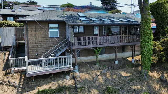 a view of a house with a roof deck