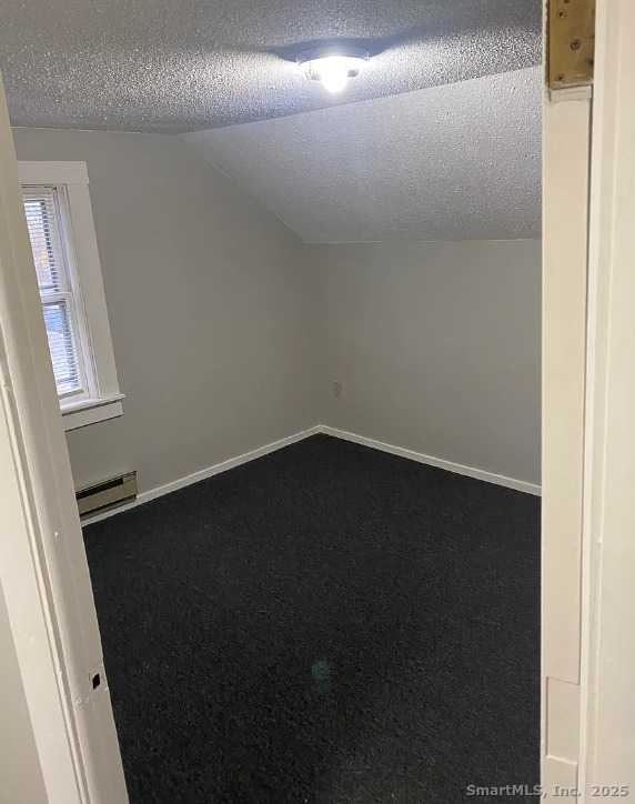 Undisclosed Address Bridgeport, CT 06610 - Photo 2 of 8 a view of a small space with wooden floor and a window