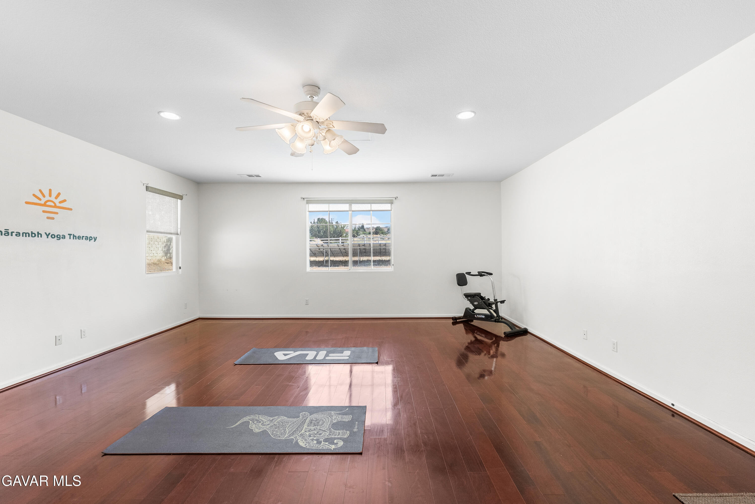 658 Lago Lindo Road Palmdale, CA 93550 - Photo 38 of 91 a view of a room with gym equipment and a window