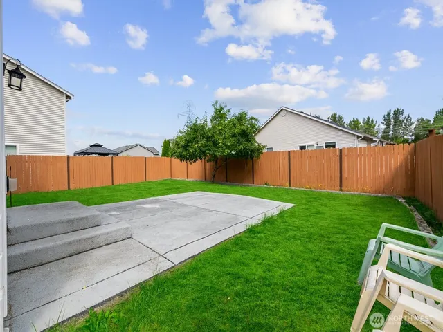 a backyard of a house with lots of green space