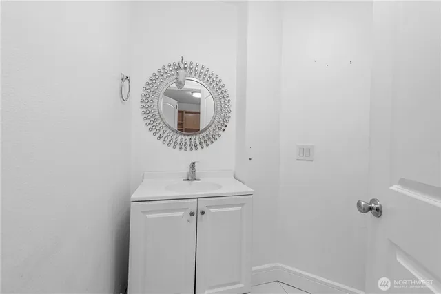 a bathroom with a sink and mirror