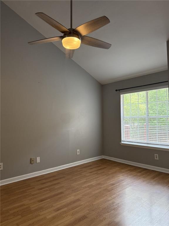 105 Hawkstone Way Alpharetta, GA 30022 - Photo 17 of 23 an empty room with wooden floor and windows