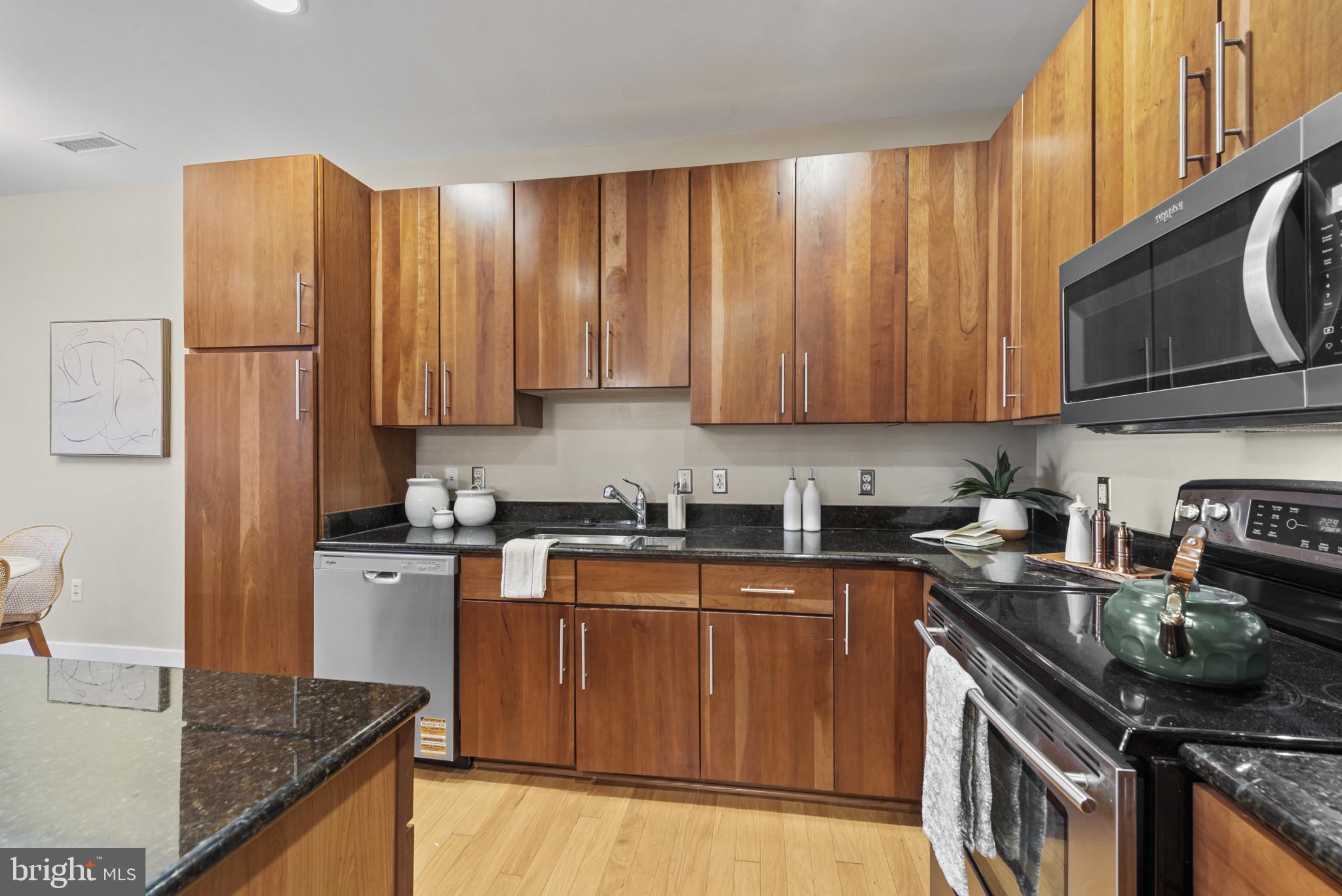 2772 Lighthouse Point East, Unit 303 Baltimore, MD 21224 - Photo 5 of 35 Abundant cabinetry.