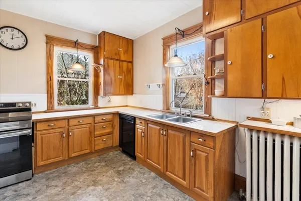 a bathroom with a sink a mirror and a shower