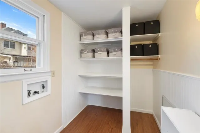 a bed room with a bed and a window