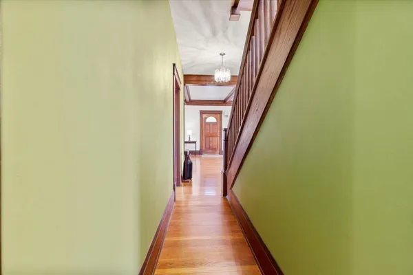 a view of a balcony with furniture and floor to ceiling window