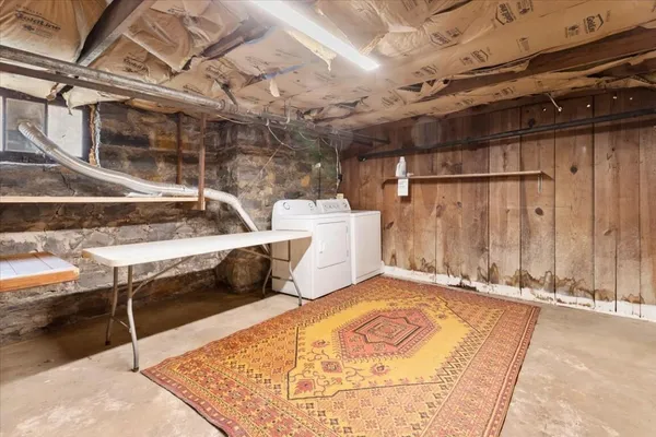 a bathroom with a sink a toilet and shower curtain