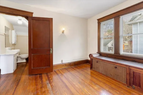 an aerial view of a residential building with parking space