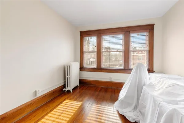 a front view of a residential apartment building with a yard