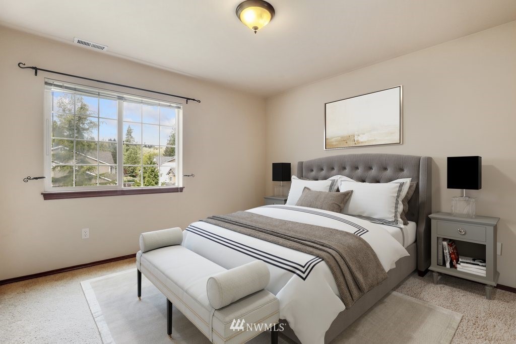 21532 11th Court Southeast Bothell, WA 98021 - Photo 17 of 36 a bedroom with a bed and a window
