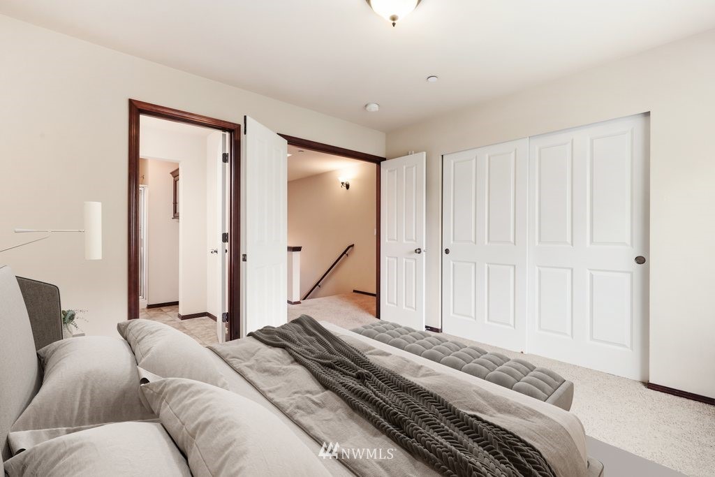 21532 11th Court Southeast Bothell, WA 98021 - Photo 18 of 36 a bedroom with a bed and a window