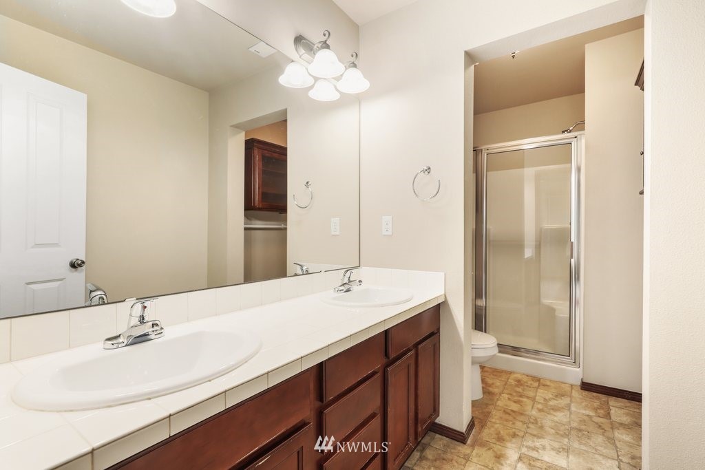 21532 11th Court Southeast Bothell, WA 98021 - Photo 19 of 36 a bathroom with a sink a vanity and a mirror
