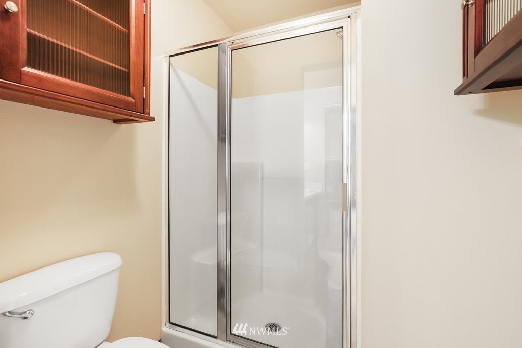 21532 11th Court Southeast Bothell, WA 98021 - Photo 20 of 36 a bathroom with a shower and a toilet