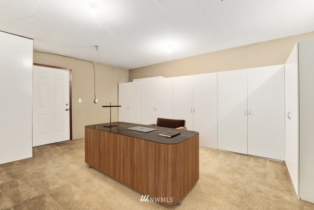 21532 11th Court Southeast Bothell, WA 98021 - Photo 27 of 36 a kitchen with stainless steel appliances granite countertop a sink stove and cabinets