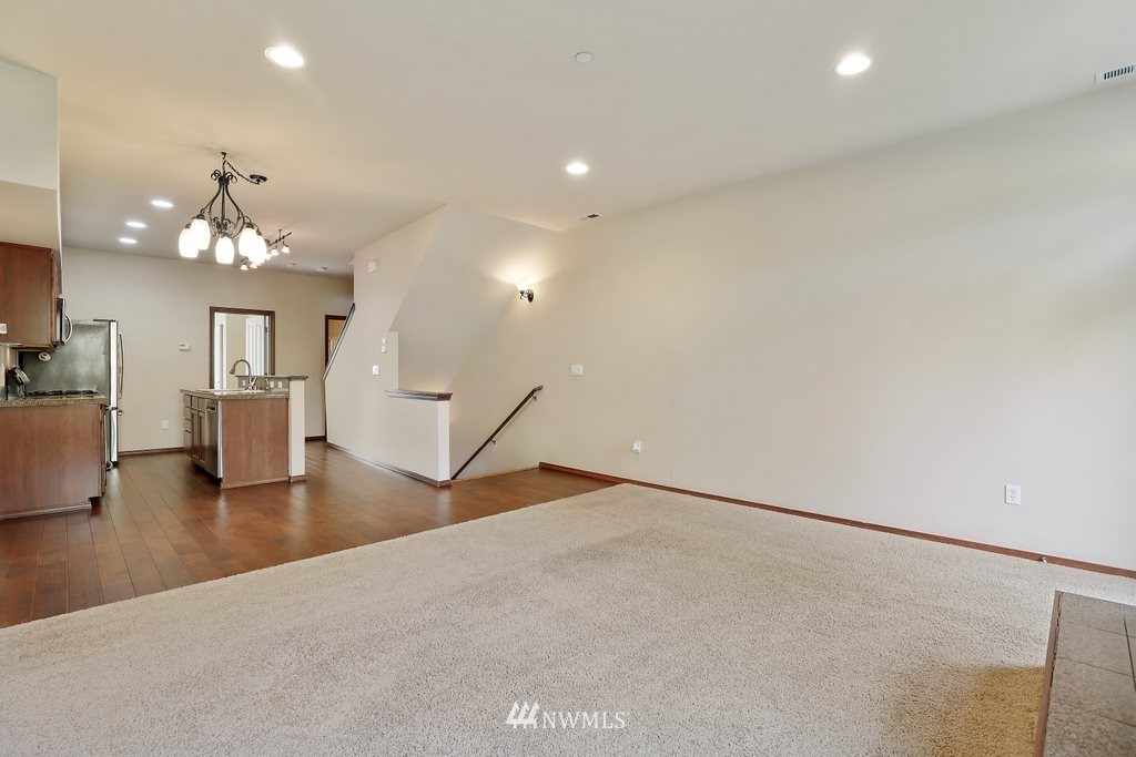 21532 11th Court Southeast Bothell, WA 98021 - Photo 4 of 36 an empty room with wooden floor and windows