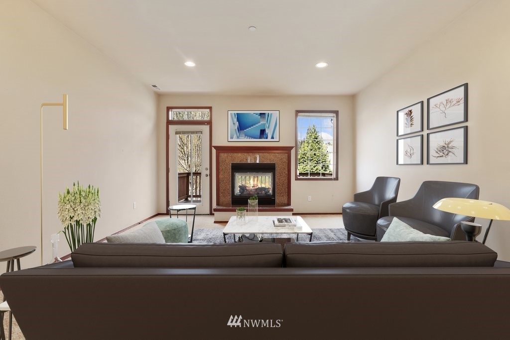 21532 11th Court Southeast Bothell, WA 98021 - Photo 5 of 36 a living room with furniture and a fireplace