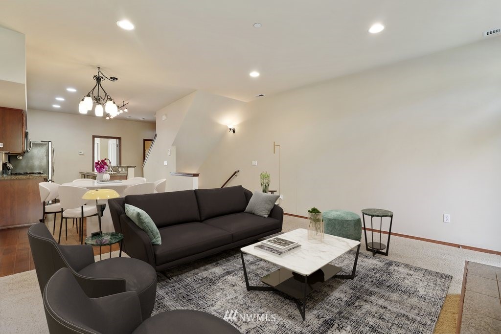 21532 11th Court Southeast Bothell, WA 98021 - Photo 6 of 36 a living room with furniture and a chandelier