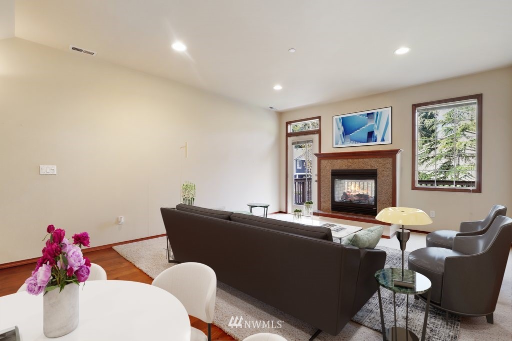 21532 11th Court Southeast Bothell, WA 98021 - Photo 7 of 36 a living room with furniture potted plant and a fireplace