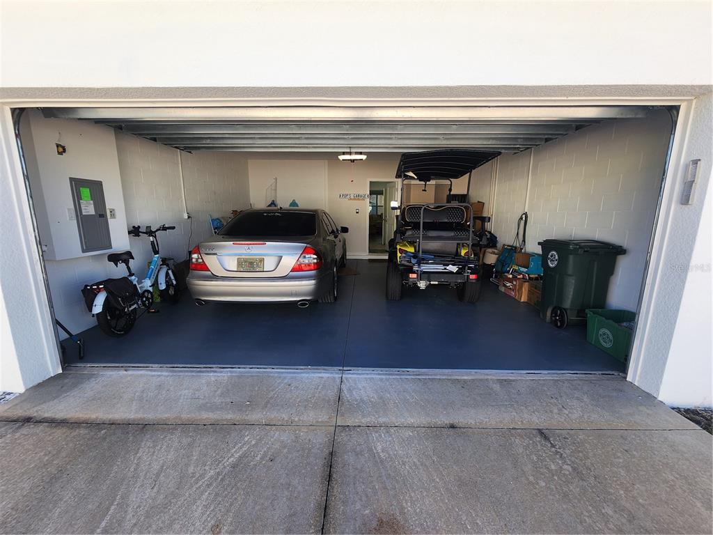 218 Ocean Hammock Loop Daytona Beach, FL 32124 - Photo 13 of 13 a car parked in garage