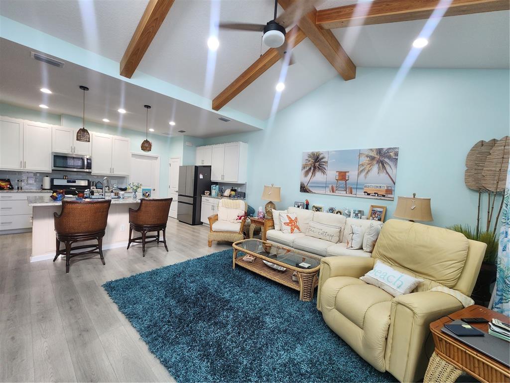 218 Ocean Hammock Loop Daytona Beach, FL 32124 - Photo 2 of 13 a living room with furniture and a rug
