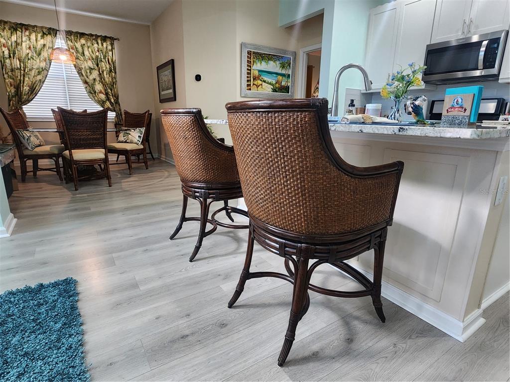 218 Ocean Hammock Loop Daytona Beach, FL 32124 - Photo 6 of 13 a view of a dining room with furniture window and wooden floor