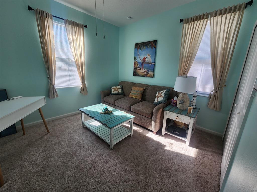 218 Ocean Hammock Loop Daytona Beach, FL 32124 - Photo 9 of 13 a living room with furniture and a window