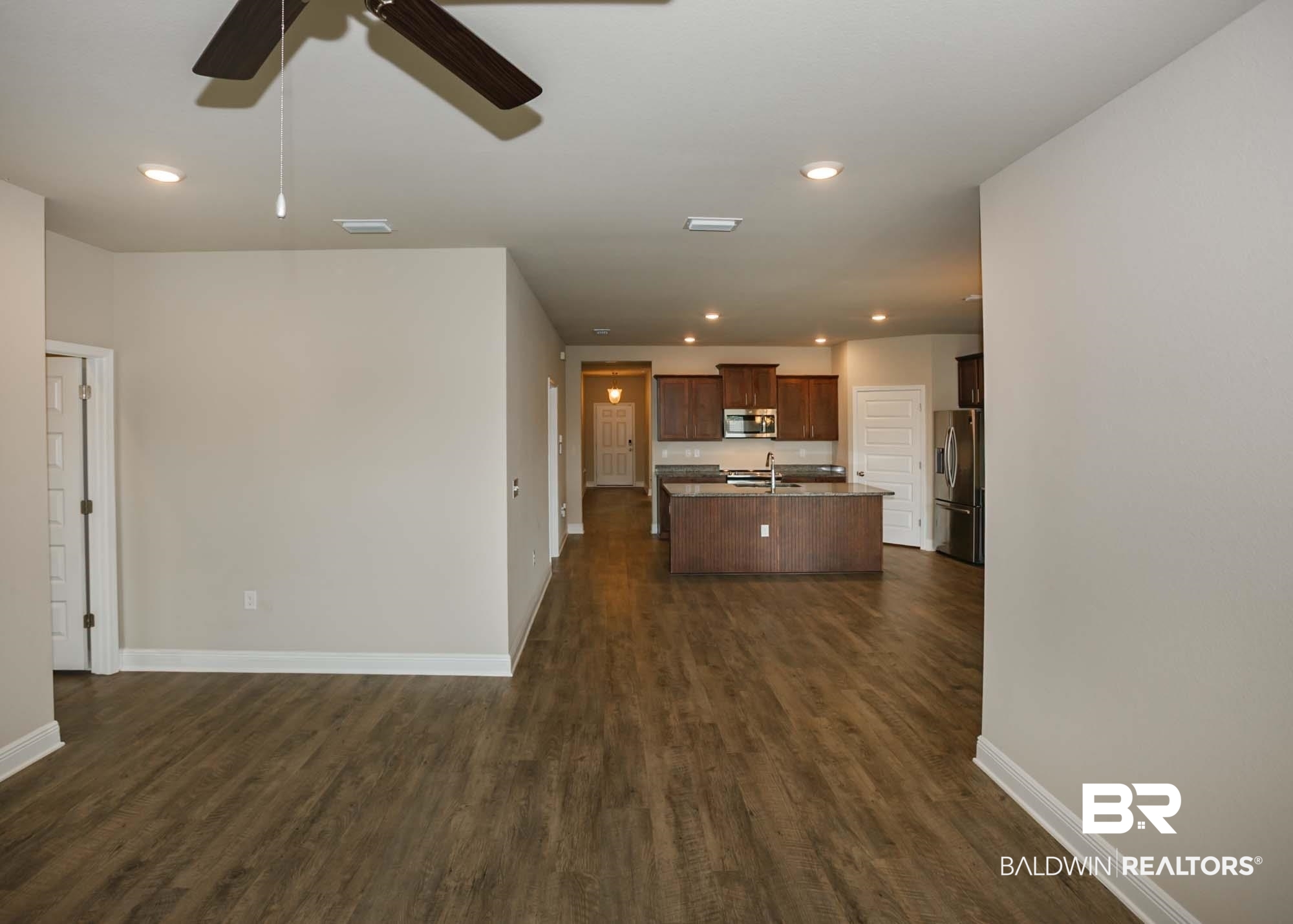 1436 Kairos Loop Foley, AL 36535 - Photo 20 of 52 Unfurnished living room featuring a ceiling fan, dark wood-style flooring, and recessed lighting
