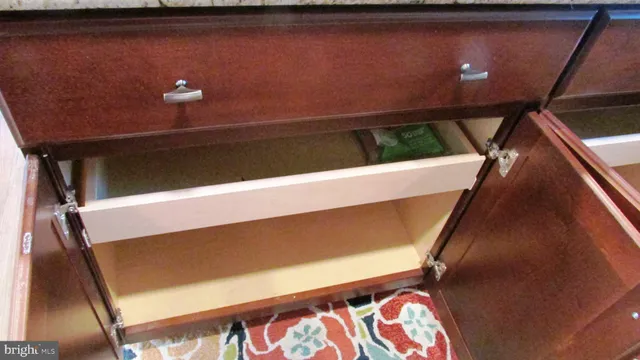 a living room with a window and a couch