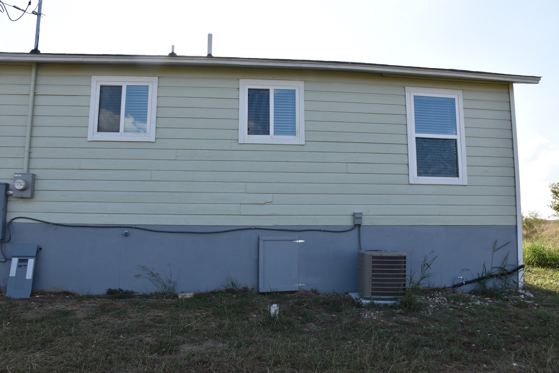 3751 County Road 463 Elgin, TX 78621 - Photo 25 of 27 a front view of a house with a yard