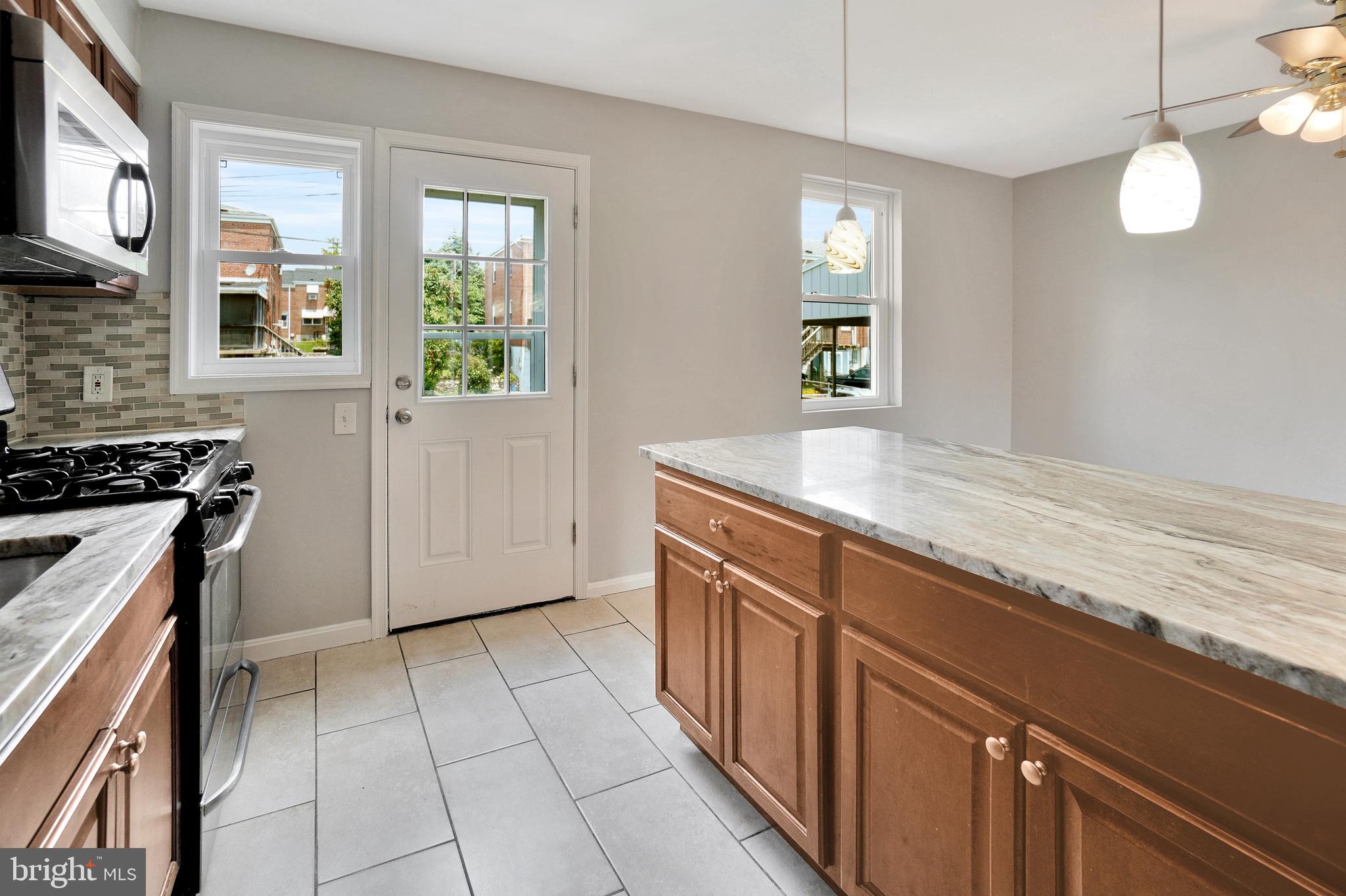 1724 Red Oak Road Baltimore, MD 21234 - Photo 22 of 24 Granite and SS appliances, door to deck