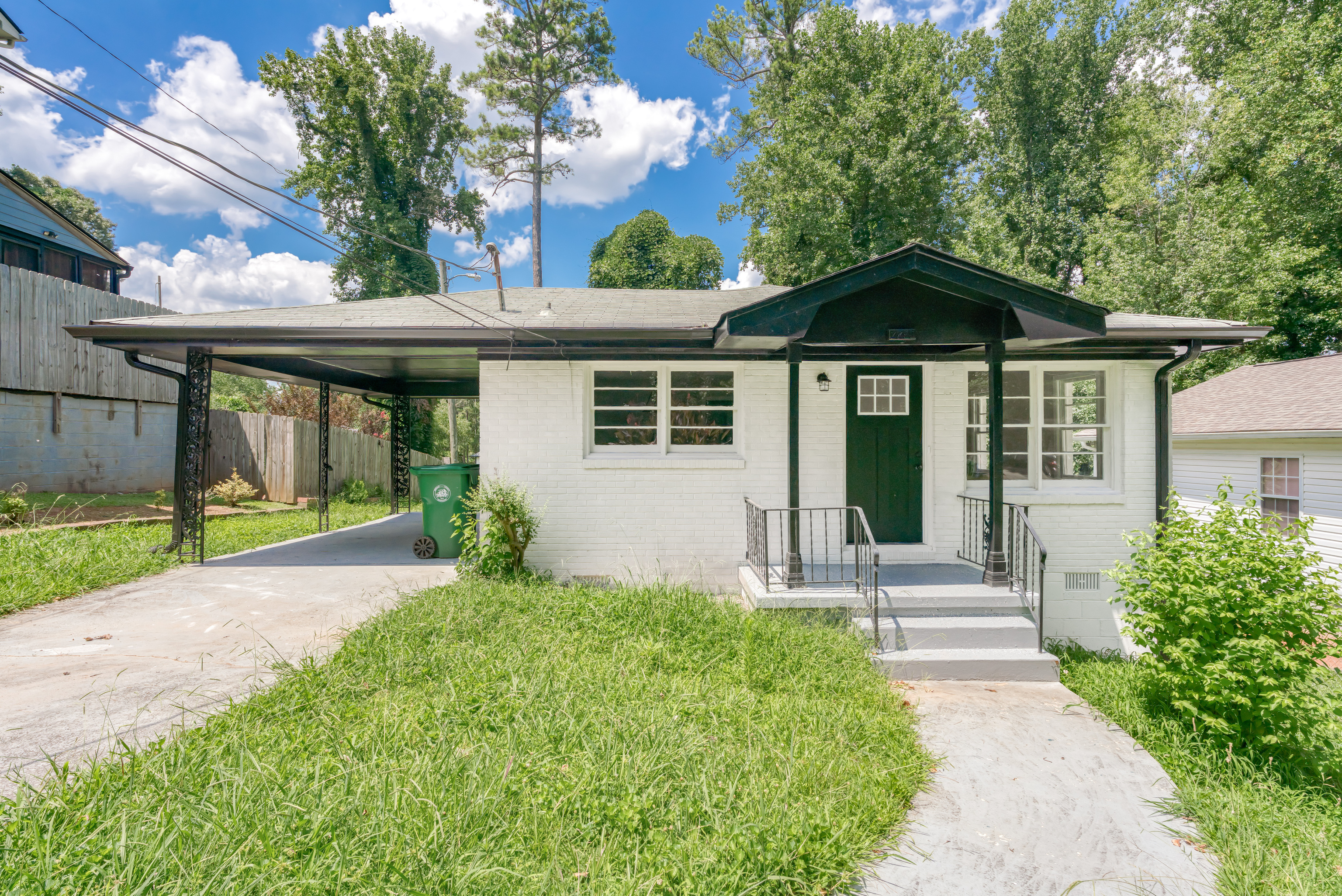 2790 Amelia Avenue Decatur, GA 30032 - Photo 1 of 1 a front view of a house with a yard and potted plants