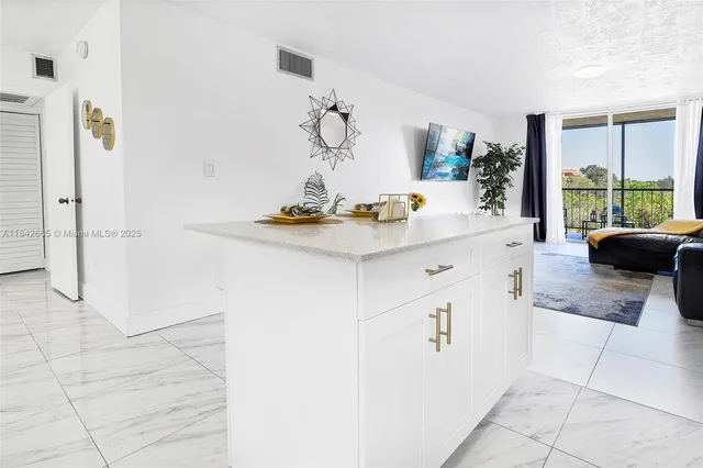a view of kitchen with furniture and large window