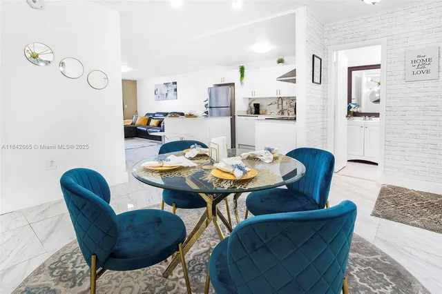 a view of a dining room with furniture