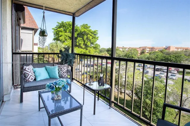a lobby with furniture and a potted plant