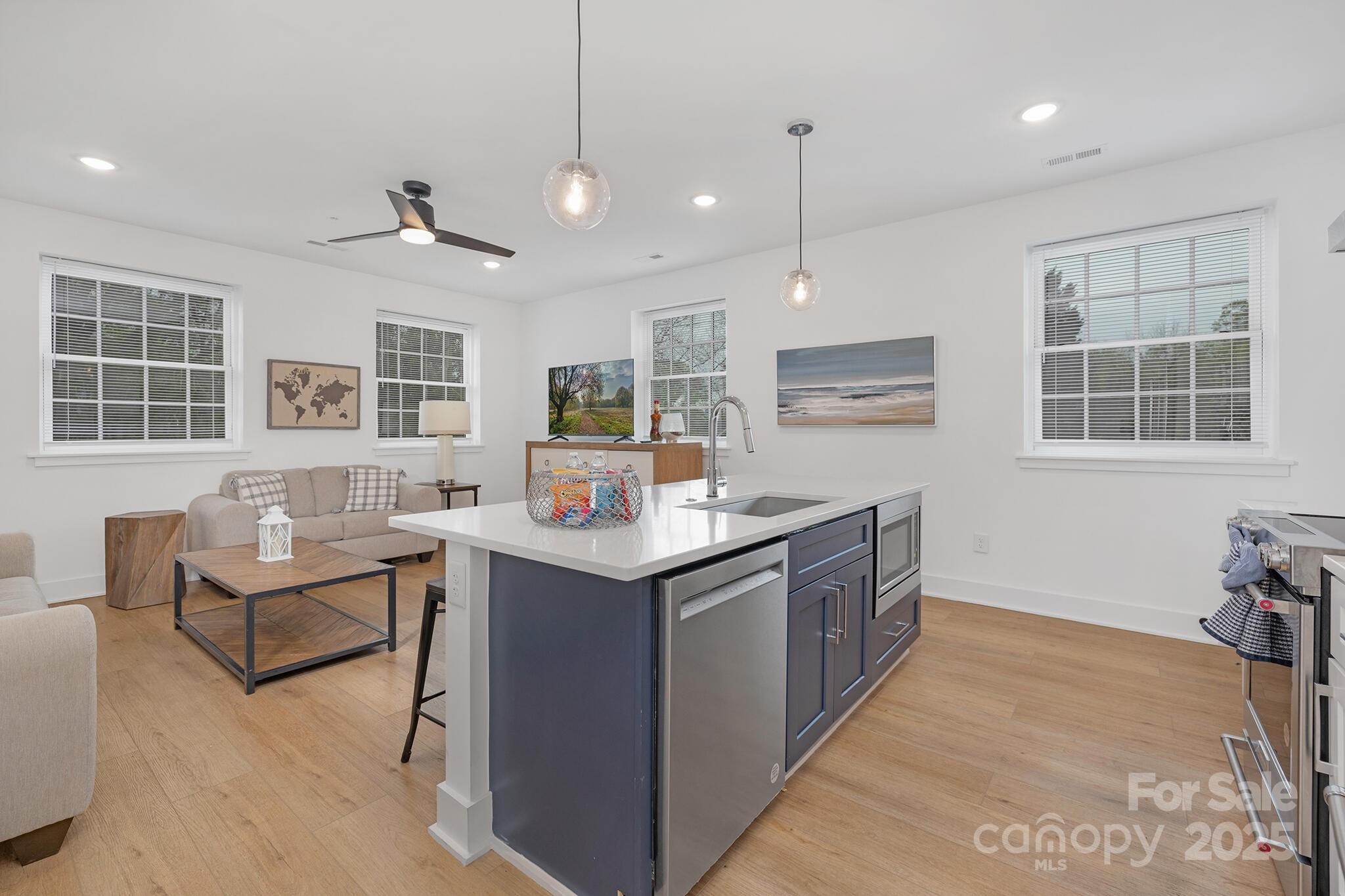 203 Grandin Road, Unit 2 Charlotte, NC 28208 - Photo 5 of 23 a kitchen with counter top space and windows