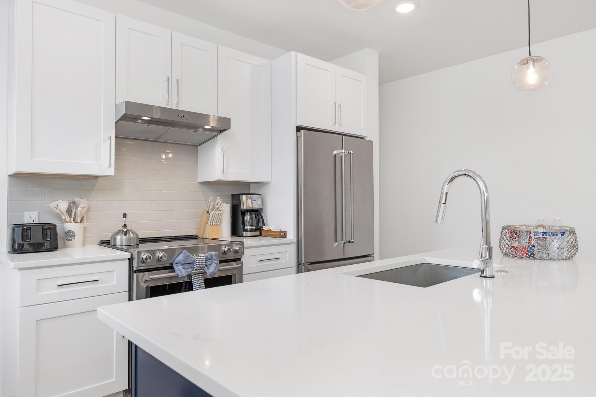203 Grandin Road, Unit 2 Charlotte, NC 28208 - Photo 8 of 23 a kitchen with stainless steel appliances granite countertop a sink stove and refrigerator