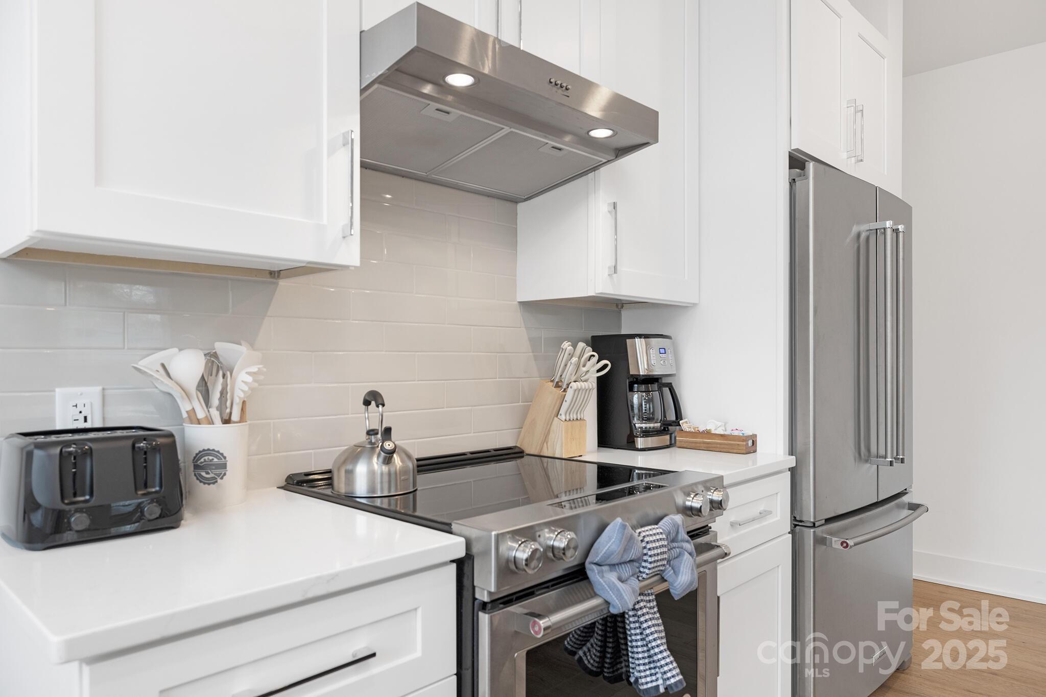 203 Grandin Road, Unit 2 Charlotte, NC 28208 - Photo 9 of 23 a kitchen with a sink appliances and cabinets