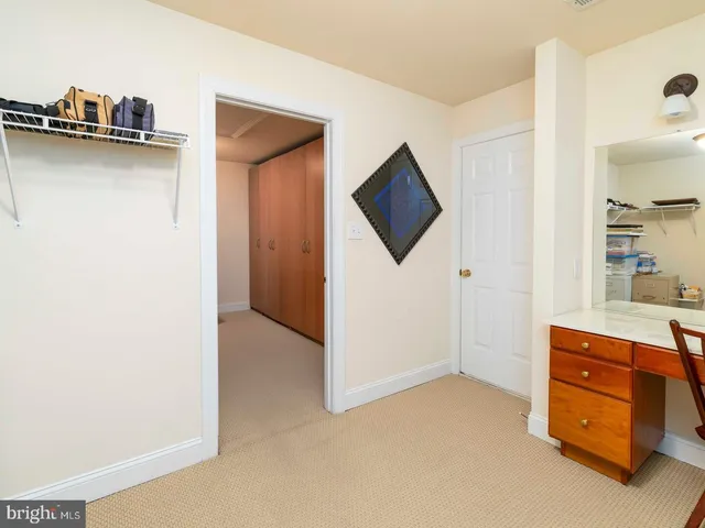 a view of room with furniture and wooden floor