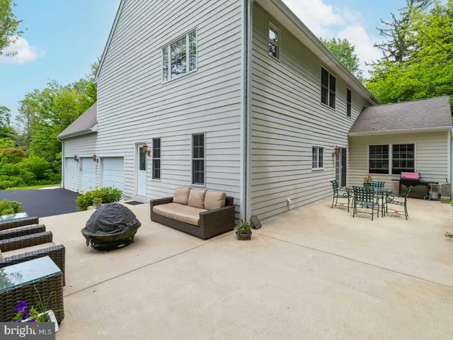 a table and chairs in front of house