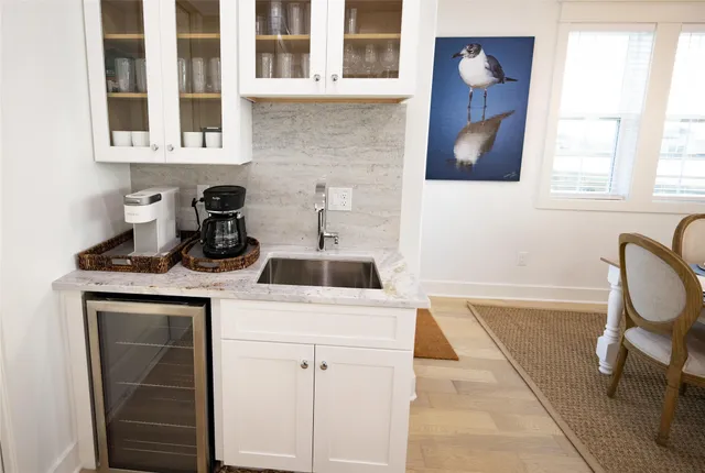 a bedroom with a bed a table and chair