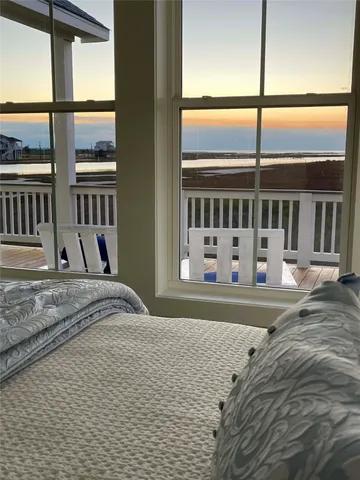a bathroom with a granite countertop sink a mirror and shower