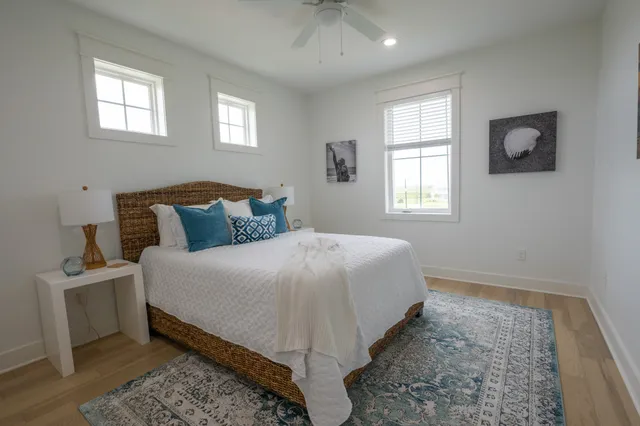 a bedroom with two beds and a table