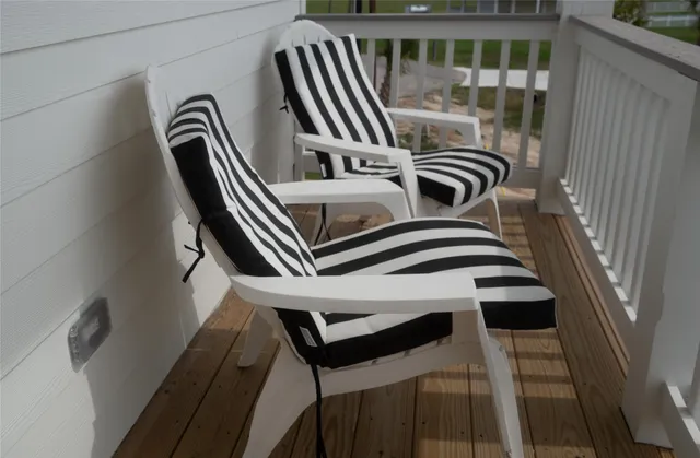 a view of a balcony with lake view and wooden floor