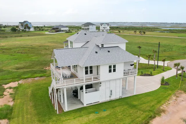 a aerial view of a house with a ocean view