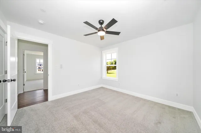 a bathroom with a granite countertop sink a toilet and a bathtub