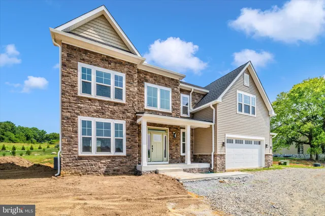 a view of a brick house with many windows