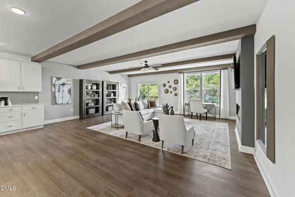 a living room with furniture and a large window