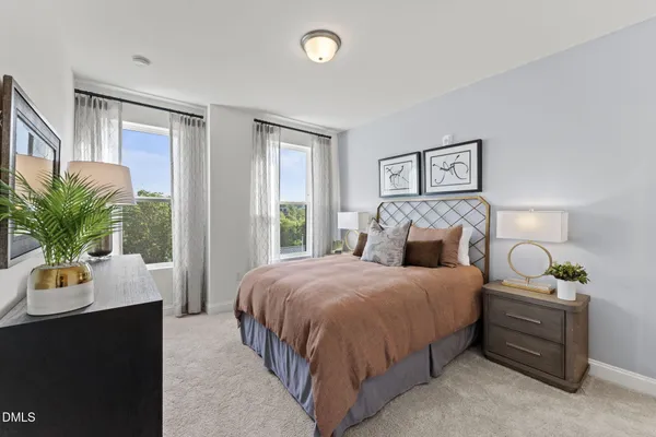 a bedroom with a bed potted plant with window