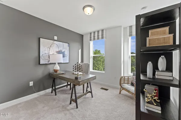 a view of a livingroom with furniture and a flat screen tv