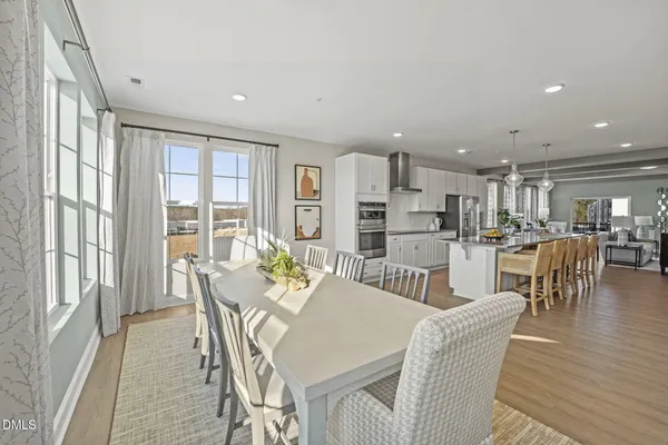 a view of a dining room with furniture window and outside view